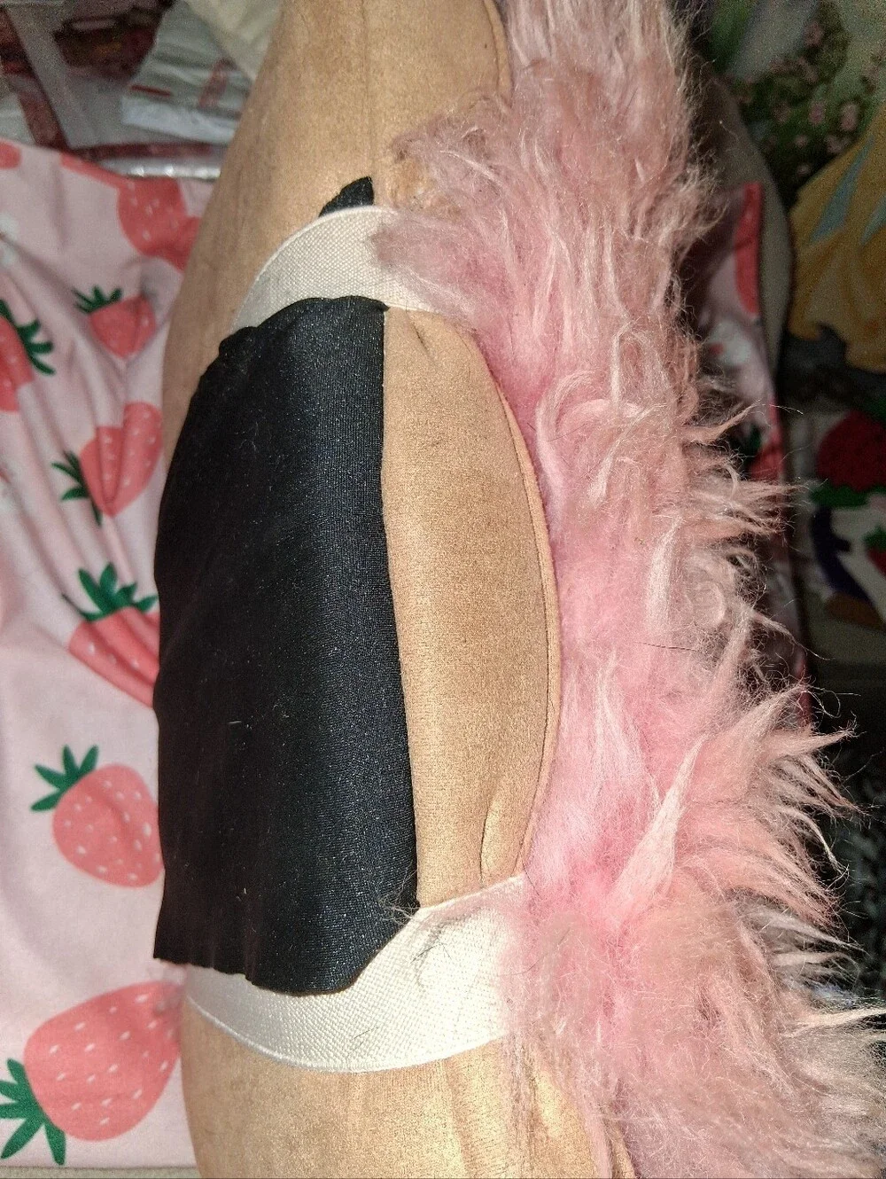 Pink Fuzzy Pilliw Attached To A Swade  Pillow